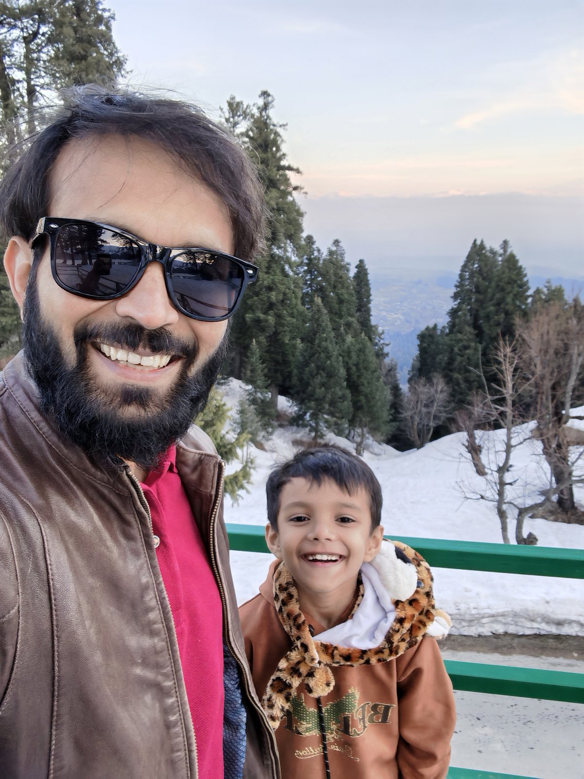 Piyush with son in the snow at Gulmarg