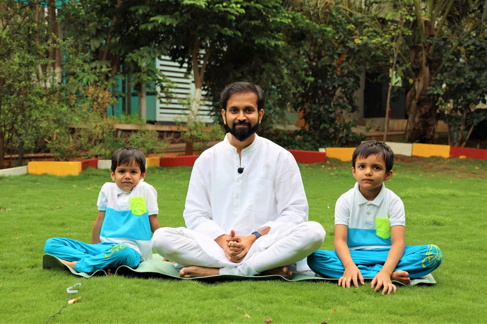 Piyush with sons Piyansh and Prajit in lotus pose